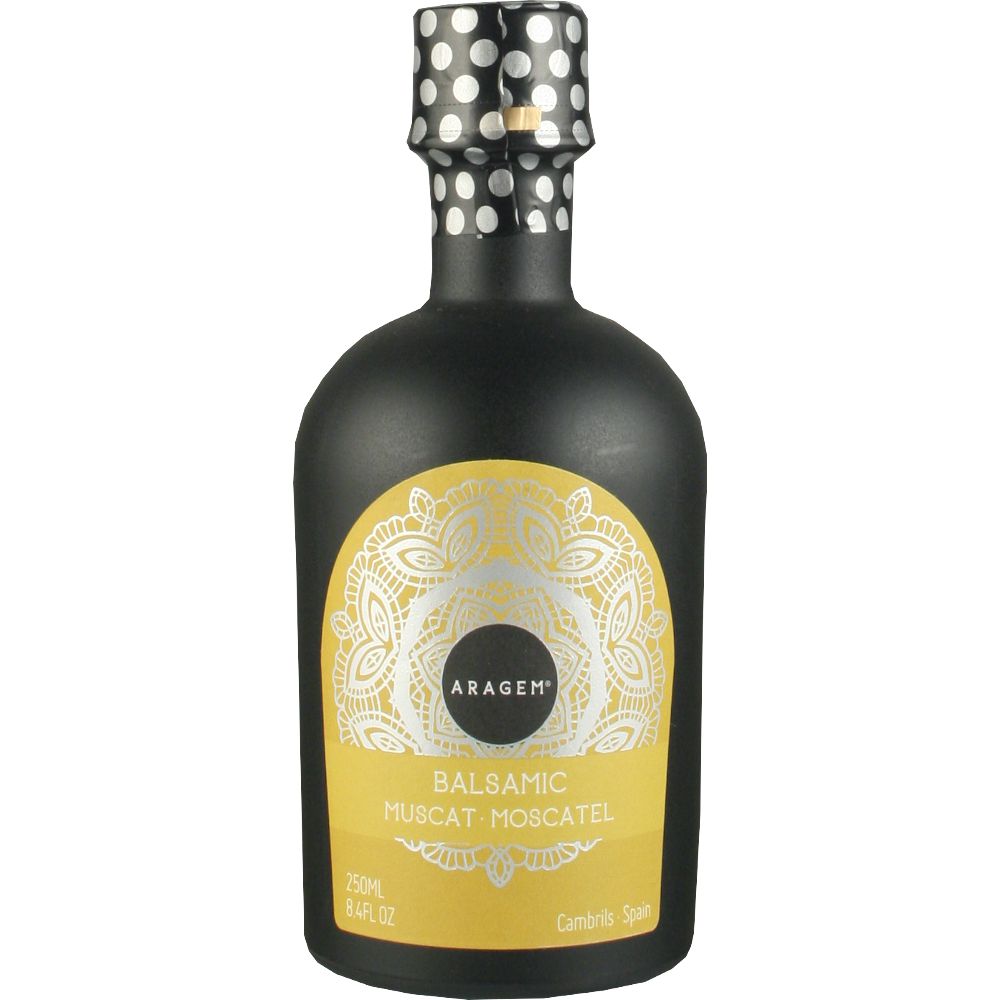 3538_0002 Weißer Balsamico Aragem Moscato in schwarzer bauchiger Flasche mit gelbem Etikett, weißem Muster und gepunktetem Schraubverschluss